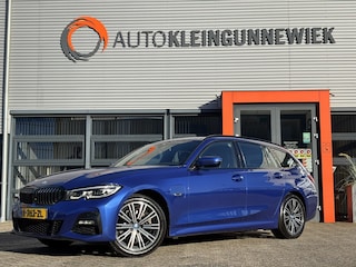 BMW 3-serie Touring /320e Business Edition Plus M Sport Pakket / Portimao Blau / Stoel & Stuurverwarming / Wegklapbare Trekhaak /