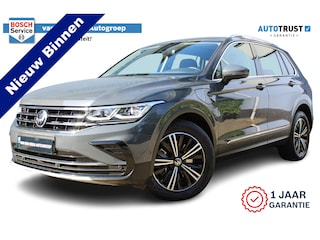 Volkswagen Tiguan 1.4 TSI eHybrid Eleganse | Incl. 12 maanden Garantie | Panorama dak | Stoel/stuur verwarming | Elektrische kofferklep | IQ. Lights | Adaptive cruise | 360* Camera | Keyless entry/start | Elektrisch verstelbare stoelen | Memory stand stoelen | Schuif/kantel dak | Draadloze telefoonlader | Navigatie | Climate controle | Apple CarPlay/Android Auto | Lederen bekleding | Dodehoeksensoren | Virtual cockpit |