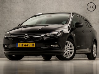 Opel Astra Sports Tourer 1.0 Online Edition (APPLE CARPLAY, NAVIGATIE, TREKHAAK, GETINT GLAS, CHROOM PAKKET, XENON, SPORTSTOELEN, BLUETOOTH, CRUISE CONTROL, NIEUWSTAAT)