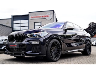 BMW X6 M50i High Executive | Carbon inleg | Krystallen Pook | Harman/Kardon | X6M look | 360 | Uitlaatklep | BMW Drive Assisted |