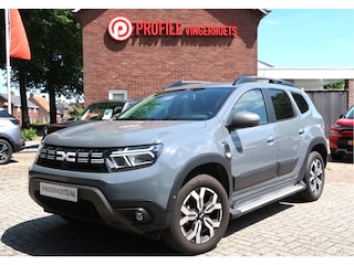 Dacia Duster 150 Pk Benzine *** AUTOMAAT * Ruige Stoere Journey Uitvoering * Navigatie * Achteruitrij Camera * Stoelverwarming * Dodehoekdetector * Climate & Cruise Control * Hoge Zit * Stoere Kleur * Vingerhoets; Vierde Generatie Eersteklas Service !
