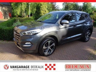 Hyundai Tucson 1.6 GDi 132pk Comfort bij Vakgarage® prijs rijklaar, met 12 maanden Bovag garantie.