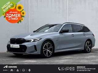 BMW 3-serie Touring 330e M-Sport Touring Plug-in PHEV Shadow Line / Wide Screen / Brooklyn Grey / 1500kg Trekgewicht / M-pakket / Parkeerassistent-pakket / 18" breedset LM wielen / Camera 360° /