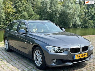 BMW 3-serie Touring 320i High Executive 2e eigenaar dealer onderhouden navigatie leerbekeleding stoelverwarming cruis control