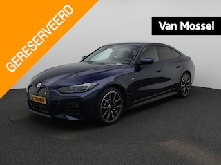 BMW i4 eDrive40 High Executive 84 kWh AUTOMAAT | M-PAKKET | SPORTSTOELEN | LEDEREN BEKLEDING | NAVIGATIE | CAMERA | ADAPTIEVE CRUISE | APPLE CARPLAY | HEAD-UP | VIRTUEEL |