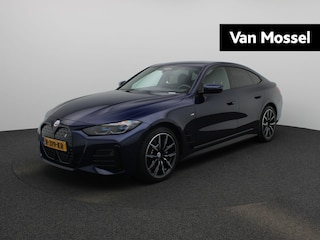 BMW i4 eDrive40 High Executive 84 kWh AUTOMAAT | M-PAKKET | SPORTSTOELEN | LEDEREN BEKLEDING | NAVIGATIE | CAMERA | ADAPTIEVE CRUISE | APPLE CARPLAY | HEAD-UP | VIRTUEEL |