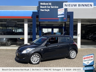 Suzuki Swift 1.2 Comfort EASSS / 5-Deurs / Panodak / 135.000 KM / Cruise-Control / Climate-Control / Stoelverwarming / Keyless / Radio / Airco / Elektr.-Ramen V+A / Verwarmbare-Spiegels / 16'' LMV / All-Season / ENZ.