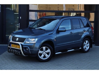 Suzuki Grand Vitara 1.9 Exclusive | NAP | Ex BTW | Grijs Kenteken | 4x4 | Airco | Navi | Trekhaak | Stoelverwarming | Leder