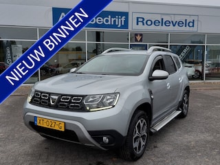Dacia Duster 1.3 TCe 131pk Prestige | Origineel NL | Navi | Clima | Cruise | Keyless Entry | Pdc | Dodehoek+Lichtsensor | Privacy Glass | 17''lm | Sidebars | Trekhaak