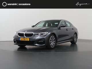 BMW 320i Business Edition M-Sport Plus | Trekhaak | Leder |  Parkeercamera | Head-Up | Stoelverwarming | Keyless Go |