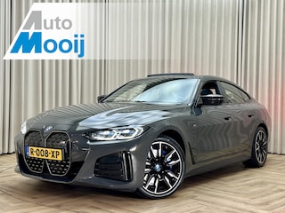 BMW i4 M50 84 kWh *M-Sport* Schuif/Kantel dak / Carbon / LASER LED / HUD / Harman Kardon / 360 Camera / Elek. Trekhaak / Org.NL!