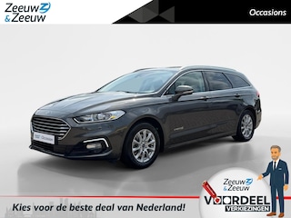 Ford Mondeo Wagon 2.0 IVCT HEV Titanium | Automaat | Navigatie | Apple carplay & Android auto | Parkeersensor voor en achter | Achteruitrijcamera | Dodehoek detectie | Stoelverwarming voor | Adaptief cruise control | Trekhaak |