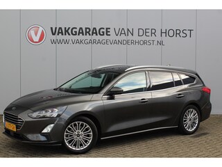 Ford Focus Wagon 1.0-125pk EcoBoost Titanium Business. Uiterst nette, comfortabele en ruime stationcar. Stoel-, stuur- en voorraamverw., Trekhaak, B&O soundsyst, lane assist, adaptieve cruise cntrl, camera a, LM wln, navigatie, telefoonvoorb. etc