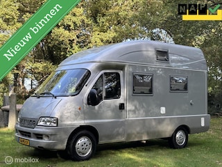 Hymer EXSIS Buscamper Compact 5,45 m Fiat 2.3 110 Pk H5 | Airco | Cruise | Camera | Orig. NL | 4 Zitpl/2 slaappl.| Hefbed | Lift-fietsendrager | Zeer nette staat