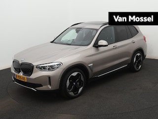 BMW iX3 High Executive 80 kWh 286 PK | 98 SOH | PANORAMADAK | HARMAN-KARDON AUDIO | ELEKTRISCHE BESTUURDERSSTOEL MET GEHEUGEN | ADAPTIVE CRUISE CONTROL | SPORTSTOELEN | 360-CAMERA | STOELVERWARMING | APPLE CARPLAY / ANDROID AUTO | WEGKLAPBARE TREKHAAK | ELEKTRISCHE ACHTERKLEP |
