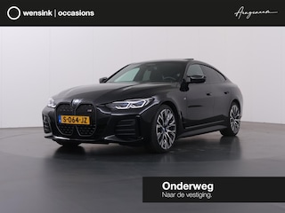 BMW i4 M50 High Executive 84 kWh | M-Sport | Schuif/Kantel dak | Sportstoelen | Harman/Kardon | x-Drive | Widescreen | Adaptief Onderstel | DAB | Stoelen/stuur verwarmbaar | Trekhaak | Laserlicht |