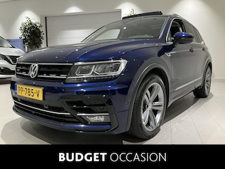 Volkswagen Tiguan 2.0 TDI Highline 150 PK DSG | Automaat | R-Line Exterieur | Trekhaak | Panoramadak | Elektrische Achterklep | Digital Cockpit Pro | Achteruitrijcamera | Stoelverwarming | Navigatie | Climate Control | Park Assist | Adaptive Cruise Control | Grootlicht Assistent | Parkeersensoren | DAB Radio | Bluetooth |