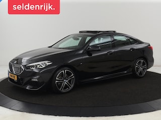 BMW 218i M-Sport | Panoramadak | Stoelverwarming | Camera | Sfeerverlichting | Carplay | Half leder | Sportstoelen | Navigatie | Live Cockpit | Full LED | Park Assist | Cruise control | Climate control
