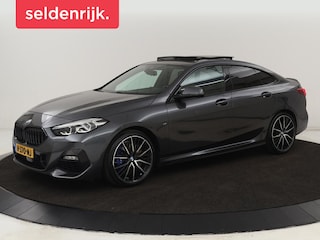 BMW 218i M Sport | Panoramadak | Sportstoelen | Leder | Camera | Carplay | Live Cockpit | Stoelverwarming | Getint glas | Navigatie | Climate control | Full LED