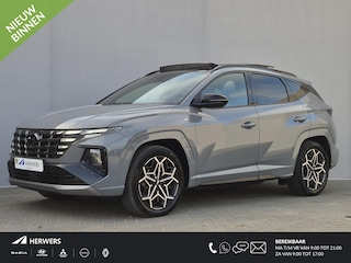 Hyundai Tucson 1.6 T-GDI PHEV Plug-in N Line Sky 4WD Automaat / Fabrieksgarantie tot 10-2027 / Trekgewicht 1350 kg / Glazen schuif- en kanteldak / EAER bereik 62 km bereik stad 74 km / Elektrische achterklep / Stuur-, Stoel en Achterbank verwarming /