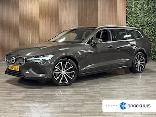 Volvo V60 2.0 T6 Plug-in hybrid AWD Essential Bright Trekhaak | All Season banden | Lederen bekleding | Adaptieve Cruise Control | Stoelverwarming voor+achter | Stuurwielverwarming | Parkeercamera | 350pk | Pilot Assist | BLIS Dode Hoek Detectie | 18 Inch | Google Infotainment | DAB Radio | Apple Carplay/Android Auto | Parkeersensoren voor+achter | Automatisch dimmende binnen en buitenspiegels | Elektrisch verstelbare lendesteunen | Volvo On Call met mobiele App functie | Platinum Grey Metallic |