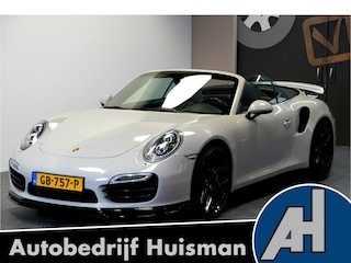Porsche 911 Cabrio 3.8 Turbo 441kW/600pk PDK7 NL-AUTO!! AKRAPOVIC COMPLEET + SPORT CHRONO + PDLS PLUS + KEYLESS DRIVE + PASM + CAMERA + STOELVERWARMING&-VENTILATIE + BOSE SOUND + TARGET BLUEYE + MOSHAMMER SPOILERPAKKET + PARKSENSOREN V&A + 20" VOSSEN LM-VELGEN!