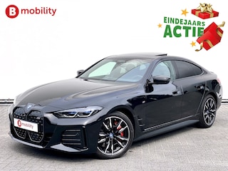 BMW i4 M50 544Pk High Executive 84 kWh Elektrisch verstelbare stoelen | Trekhaak 1600kg | Schuif/Kanteldak | Driving Assistant Professional | Harman Kardon Sound System | Head Up Display | Verwarmbaar stuurwiel | Interieurlijsten Carbon Fibre | Parking Assist.