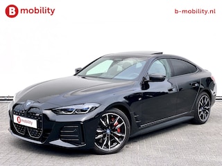 BMW i4 M50 544Pk High Executive 84 kWh Elektrisch verstelbare stoelen | Trekhaak 1600kg | Schuif/Kanteldak | Driving Assistant Professional | Harman Kardon Sound System | Head Up Display | Verwarmbaar stuurwiel | Interieurlijsten Carbon Fibre | Parking Assist.