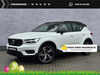 Volvo XC40 Plug-in Hybrid T5 R-Design | Adaptive cruise control | Harman Kardon audio | Stoel- en stuurverwarming | Elektrische stoelverstelling | Achteruitrijcamera | Voorruitverwarming | Parkeersensoren voor + achter | Dode hoek detectie BLIS |