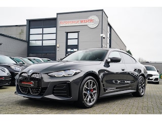 BMW i4 M50 High Executive 84 kWh | BTW | 360 Camera | LASER | Dravitgrau metallic | Adaptieve Cruise | Trekhaak | Schuif/kanteldak