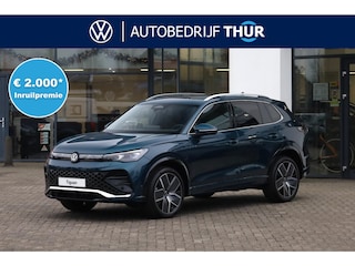 Volkswagen Tiguan 1.5 eHybrid R-Line Edition 272PK / 200kW LED Matrix IQ.Light, rondomzichtcamera, Apple Carplay & Android Auto, elektr. bedienbaar panoramadak, voorstoelen verwarm- en ventileerbaar met massagefunctie, achteruitrijcamera, elektr. uitklapbare trekhaak met aanhanger manoeuvreerfunctie (Trailer Assist), full map navigatie, 3-zone Climatronic, head-up display, Keyless Entry & Start, high end audio installatie, elektrisch bedienbare achterklep met sensorsturing, dodehoekdetectie (Side Assist), file assistent, dynamische grootlichtassistent, autonome parkeerfunctie (Park Assist), volledig digitaal instrumentenpaneel (Digital Cokpit Pro), 20'' LMV 'York'