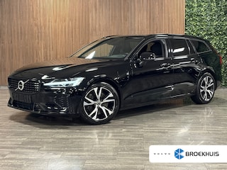 Volvo V60 T6 AWD Recharge R-Design Adaptieve Cruise Control | Stoel en Stuurwielverwarming | Parkeercamera | Full LED Meesturende koplampen | Pilot Assist | Bestuurdersstoel elektrisch geheugen | Contour stoelen met wit stiksel en bies | Zitting verlenging voorstoelen | 18 Inch | Keyless Drive | Parkeersensoren voor+achter | Privacy Glass | Elektrisch bedienbare achterklep | DAB Radio | Apple Carplay/Android Auto | Volvo On Call met mobiele App functie |