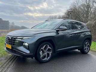 Hyundai Tucson 1.6 T-GDI 230pk HEV Premium | Leder | Carplay | Climate | Keyless | Navigatie | Elek. Klep | Full - Led | 360 Camera | KRELL Audio | Elek. Stoelen | 19" Lichtmetaal | Winterpakket | Stoelventilatie | Dodehoek Detectie