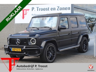 Mercedes-Benz G-klasse 63 AMG Manufaktur/Night pakket/Magno matt/Panoramadak/Burmester/Sfeerverlichting/Entertainment schermen/Akrapović/AMG active ride control/Elektrisch verstelbare stoelen met memory + massage/Stoel verwarming + koeling/360° camera/voorruitverwarming/IWC/Ala