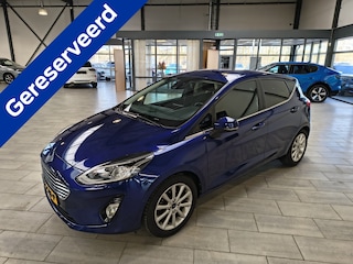Ford Fiesta EcoBoost 100 pk Titanium | Trekhaak | Camera | Adapt. cruise | B&O | 4 seiz. banden | 100% dealer onderh.