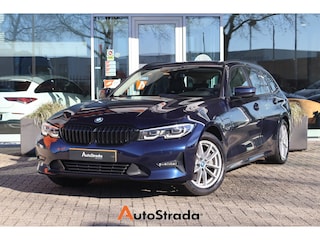 BMW 3-serie Touring (g21) 320e 204pk I HiFi I Navi I Carplay I Stoelverwarming I LED I Cruise I Tansanitblau