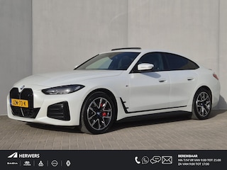 BMW i4 eDrive35 M Sport Edition 70 kWh Automaat / Accu SOH 100% / CCS snellader / Dealer onderhouden / Wide Screen display / Schuifdak / Parkeerassistent pakket / Hifi en DAB / Trekgewicht 1600 kg / Voorstoelen verwarmd / Apple Carplay Android Auto /