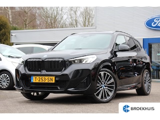 BMW iX1 xDrive30 Launch Edition 67 kWh | NL-AUTO! | 1E EIGENAAR! | M-SPORT | HALF LEDER | CAMERA | DODE HOEK | LANE ASSIST | DEALER OH! | PARK SENS V+A | CRUISE | LED | NAVI | 18" LMV