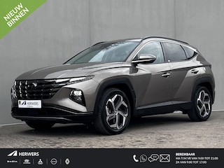 Hyundai Tucson 1.6 T-GDI HEV Comfort Smart Automaat / Dealer onderhouden / Afneembare trekhaak 1.650 kg / Elektrische klep / Adaptieve CC / Stuur- & stoelverwarming  / Navigatie / Camera / Apple Carplay Android / 19" LM + all season banden /