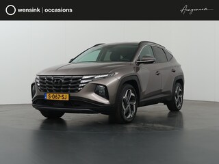 Hyundai Tucson 1.6 T-GDI HEV Premium | Trekhaak | Lederen bekleding | Ele.verstelbare stoelen + geheugen | Stoel/Stuur verwarming | Navigatie | DAB | 360 Camera | Apple CarPlay/Android Auto | Stoelkoeling | Adaptieve Cruise Control | Krell Audio |