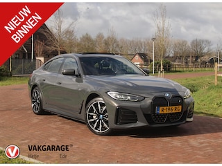 BMW i4 eDrive40 84 kWh | M-Pakket | Schuifdak | Dravitgrau metallic | NL-Auto |