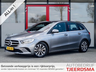 Mercedes-Benz B-klasse 180 Business Solution | Origineel NL | 2e Eigenaar | Navigatie | Camera | Climate Control | Cruise Control | Wide Screen | All Season Banden | 16'' Lichtmetalen Velgen | Metallic Lak | Dimlichten Automatisch |