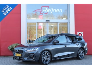 Ford Focus Wagon 1.0 155PK AUTOMAAT Hybrid ST LINE | ALL SEASON BANDEN | NAVIGATIE | DRAADLOZE APPLE CARPLAY/ANDROID AUTO | ADAPTIVE CRUISE CONTROL | LANE ASSIST | DODEHOEK DETECTIE | PARKEERSENSOREN VOOR + ACHTER | ACHTERUITRIJ CAMERA | LICHTMETALEN VELGEN 17" | DAB+ RADIO |