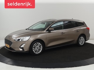 Ford Focus 1.0 EcoBoost Titanium | Stoelverwarming | Trekhaak | Adaptive cruise | Carplay | Keyless | Navigatie | Parkeerhulp | Stuurverwarming | Climate control | Getint glas