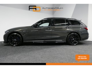 BMW 3-serie Touring 330e xDrive M Sport / M340i Diffuser /  Black Diamond M grille / M340i M Sport bumper pakket / BMW Laser Light / Panoramadak / Premium kleur Dravitgrau / Elektr. verstelbare voorstoelen links met memory / Apple Carplay - Android Auto / Stoelverwarming / HUD / 19'' LMV / Trekhaak (afneembaar) / Lederen bekleding / Adaptief M onderstel