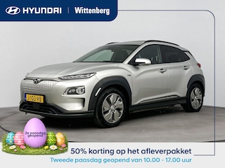 Hyundai Kona EV PREMIUM 64 kWh | 3- FASE | NAVI | CLIMA | CRUISE | CAMERA | HUD | LEDER | SCHUIFDAK | STUUR- & STOELVERWARMING | WARMTEPOMP | PRIVACY GLASS | WLTP 481 KM! |
