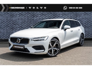 Volvo V60 T6 Plug-in hybrid AWD Essential | Google | Longe Range | Stuurverwarming | Park Assist | Getint Glas | Stoelverwarming Voor + Achter | Zwarte Hemelbekleding | Camera | Lederen Bekleding | Zitverlenging | 19" LM