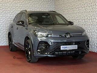 Volkswagen Tiguan 1.5 eHYBRID 272 PK NW AUTO R-LINE VW.TREKHAAK BLACK PANO XL.NAVI STOEL/STUUR VERW. BLACK.STYLE 360.CAM ELEK.KLEP MATRIX.LED 20''LMV MASSAGE SCHUIFDAK PHEV PLUG IN HYBRID ✅Top Auto's Wijchen , 30 Jaar Specialist in Volkswagen  : Alle Type's : R-Line Edition / Style / First Edition / Highline / Life , Zowel PHEV / HEV / MHEV / Benzine ✅