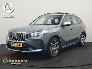 BMW iX1 xDrive30 Launch Edition 313pk Dealer O.H | Panodak | Adaptive Cruise | 360 Camera | Lederen Comfortzetels Massage & Memory | Head Up | Harman Kardon | Keyless |