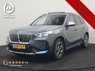 BMW iX1 xDrive30 Launch Edition 313pk Dealer O.H | Panodak | Adaptive Cruise | 360 Camera | Lederen Comfortzetels Massage & Memory | Head Up | Harman Kardon | Keyless |